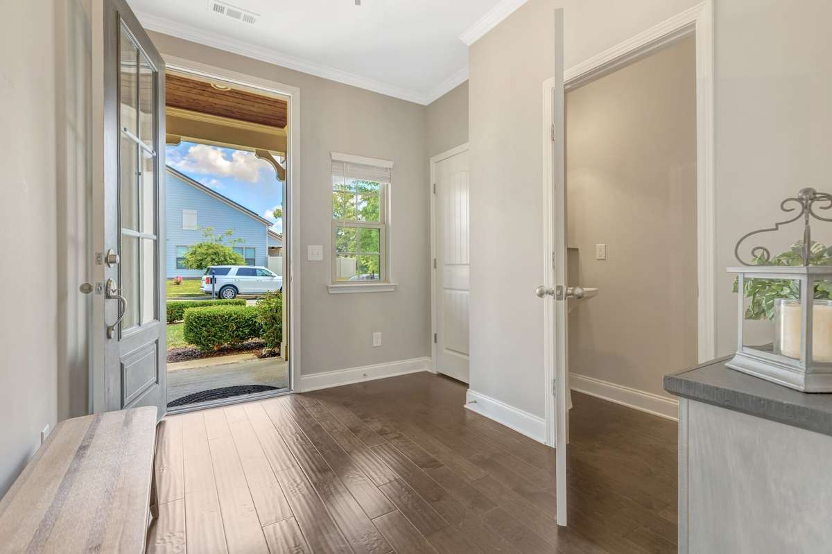 Large entry with wood flooring throughout the downstairs