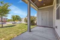 Covered patio and note, a large yard behind. Not another unit!! Also, a large storage closet