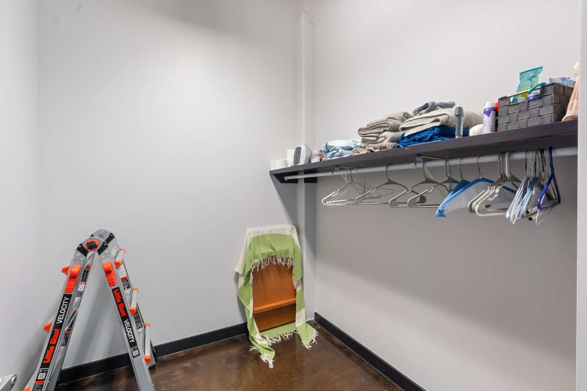 This closet would look spectacular with added shelves/drawers. It's even larger in person.