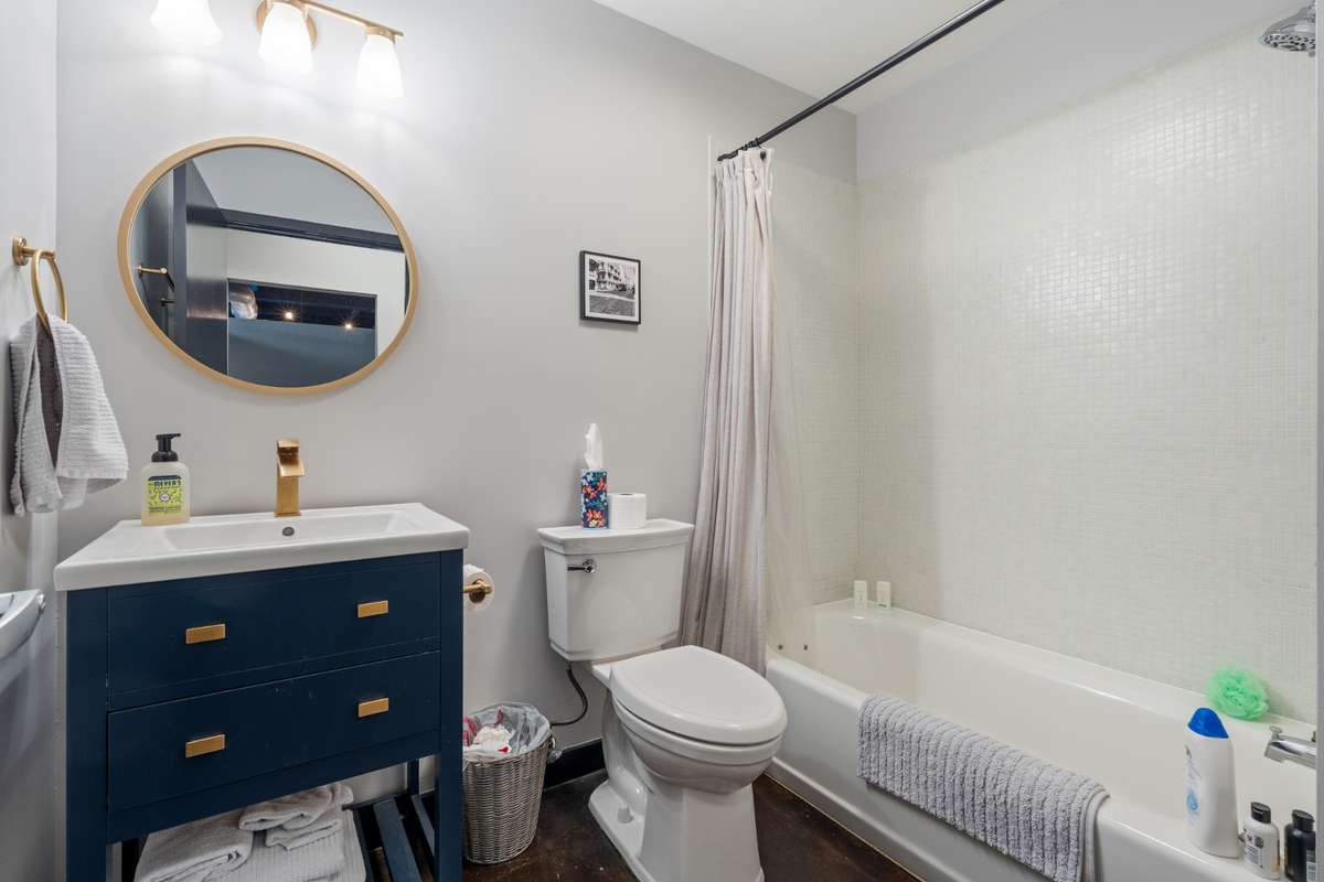 Full bathroom in second bedroom with shower/tub combo.