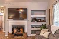 Spend your chilly nights right by the fireplace.  The living features stunning built-ins for your most treasured keepsakes and pictures.