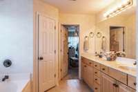 Welcome to the elegant ensuite bathroom in the primary suite.