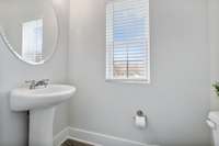 Photo of similar home in the same community. Half bath on main level