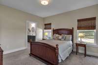 Master bedroom with master bath in the background.
