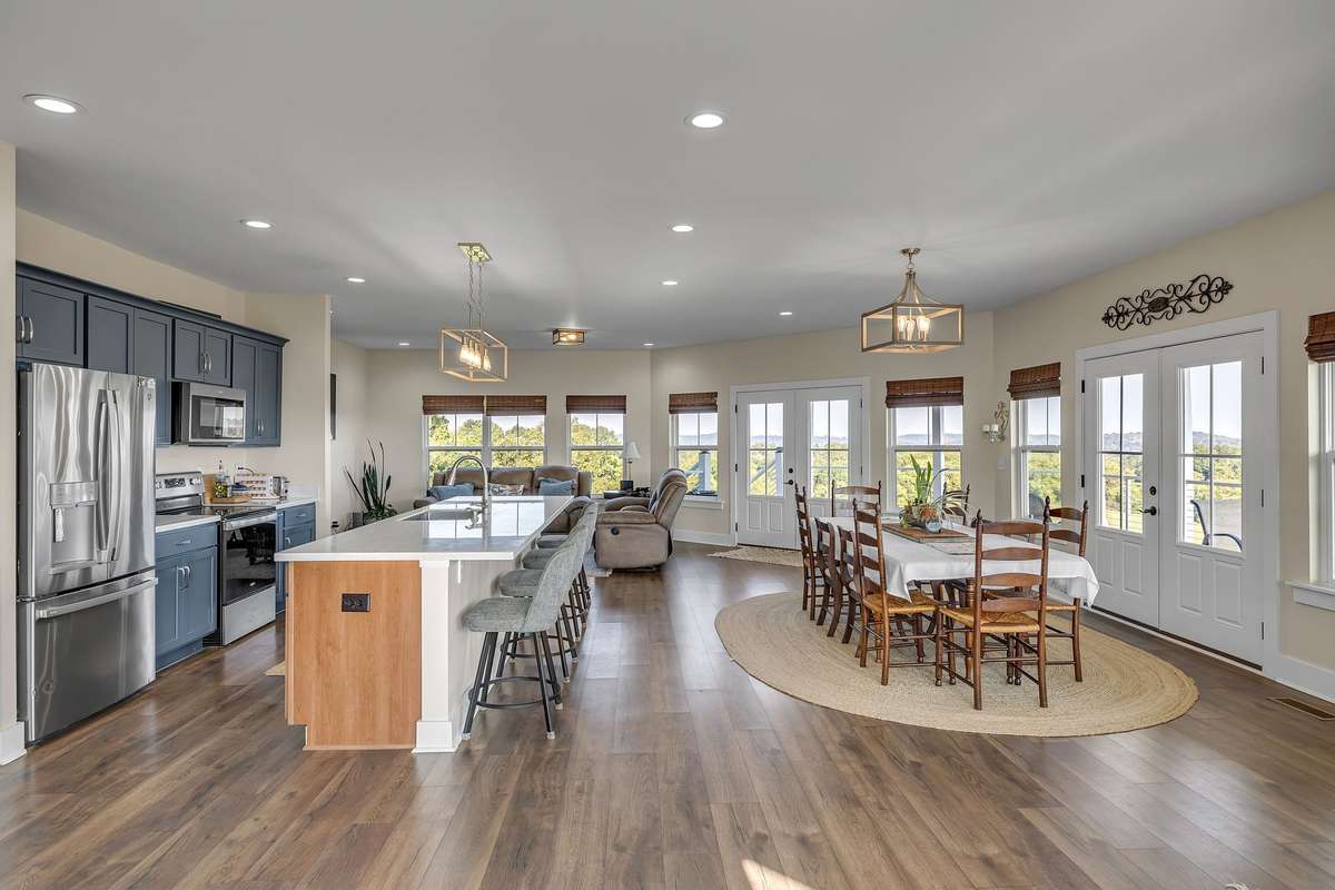 This is a true great room with kitchen, family room and dining area with bar area over looking the kitchen.