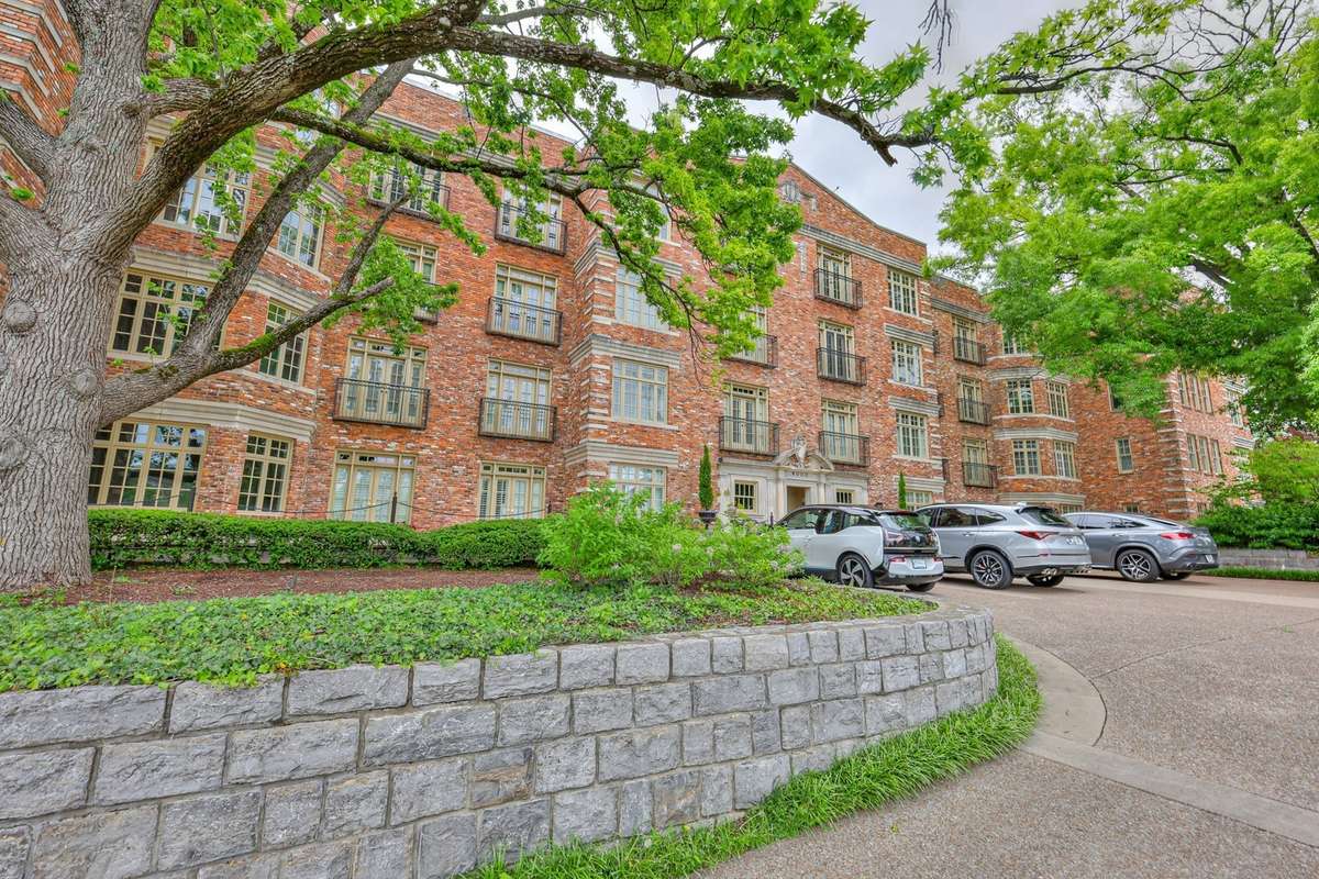 Verdant and well-kept, this building's exterior sets the stage for the elegance found within.