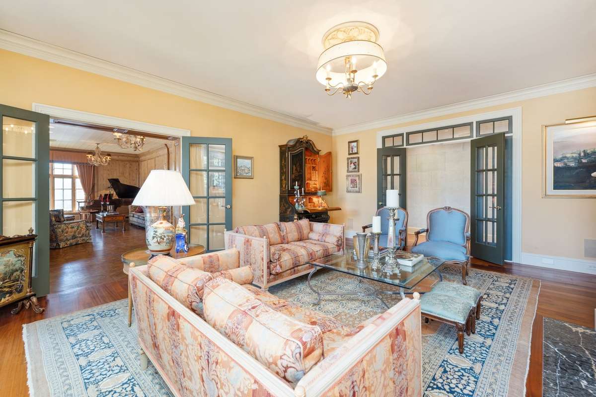 Offering the illusion of an open floor layout, the wide doorways are accentuated with stunning painted French doors. Pictures taken when home was furnished. Condo is currently unfurnished.
