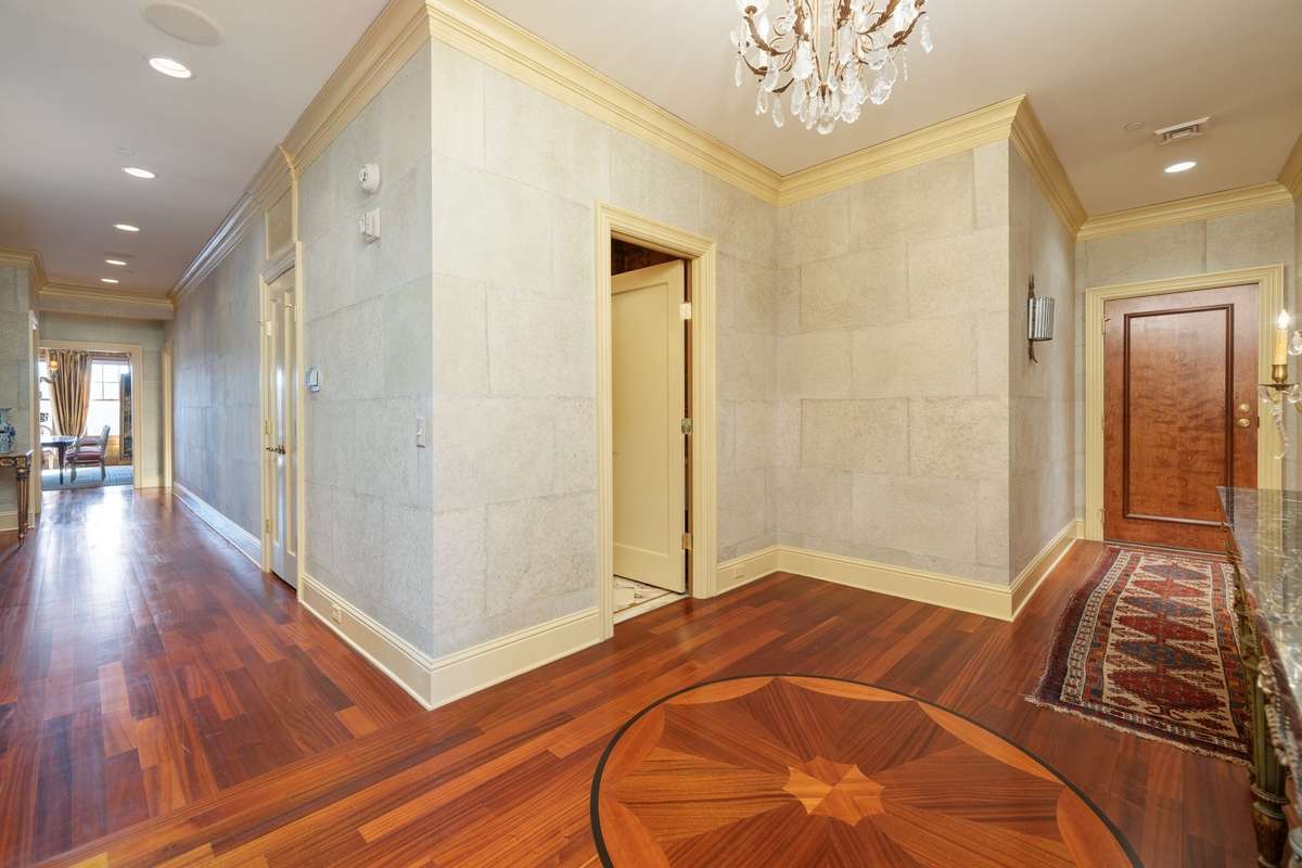Grand yet warm, your eye is drawn upwards in the foyer with a gorgeous chandelier and stacked crown molding.