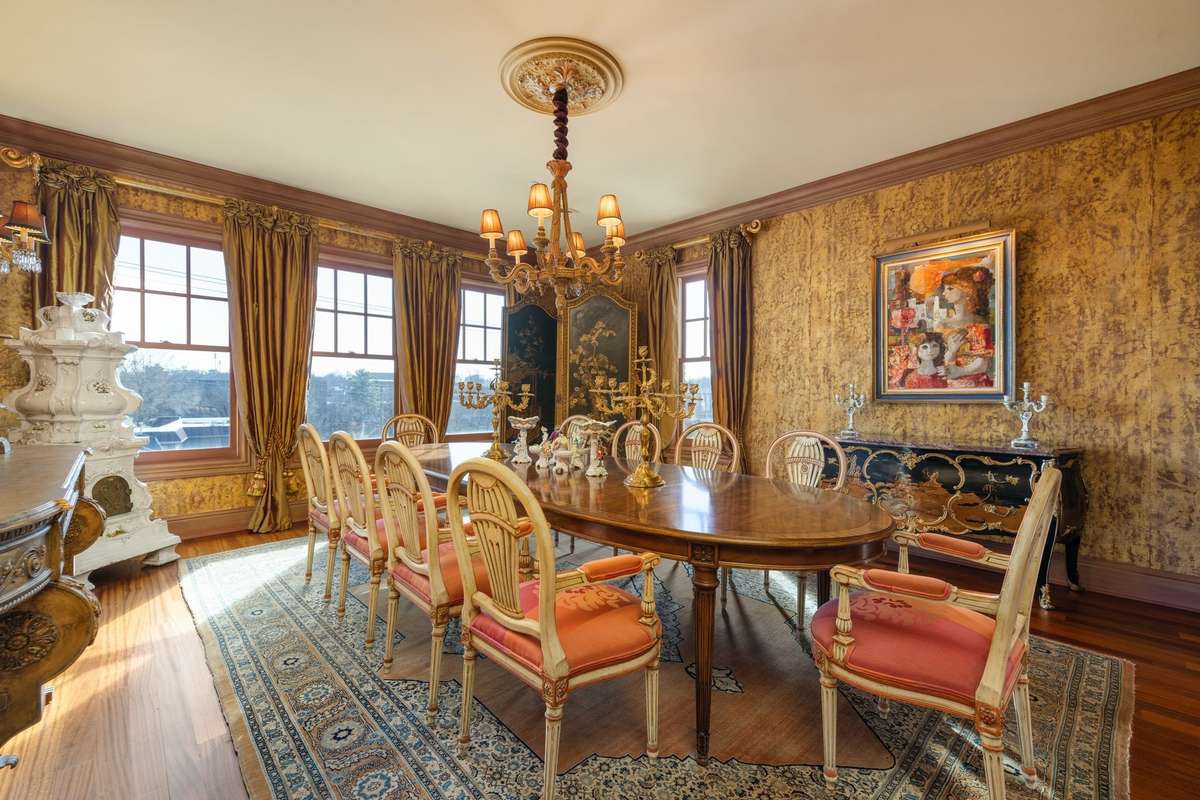 The spacious formal dining room comes with a lovely view of West End, ideal for entertaining. Pictures taken when home was furnished. Condo is currently unfurnished.
