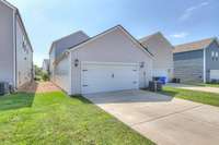 The rear entry garage also has plenty of extra parking. The garage has been upgraded with painted walls and newer ball bearings on the garage door.