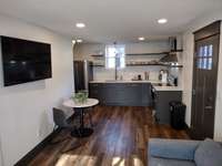 Studio: Has its own separate entrance, on the lower level it has 9ft ceilings, featuring a bright and airy open floor plan, kitchen/eat-in and living room.