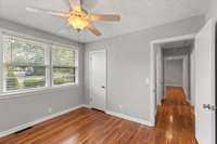 Another view of the secondary bedroom and hallway.