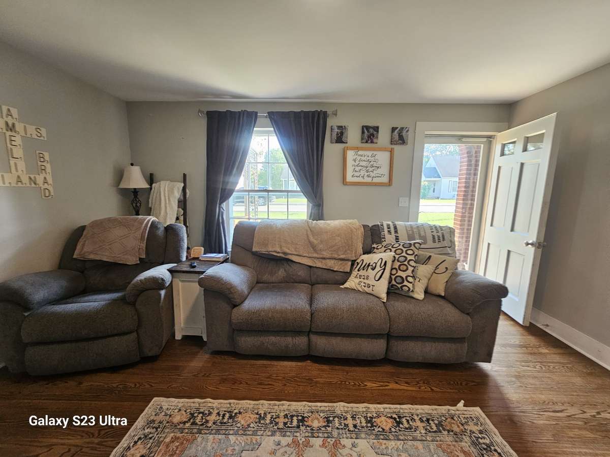 Cozy living room with original hardwood floors