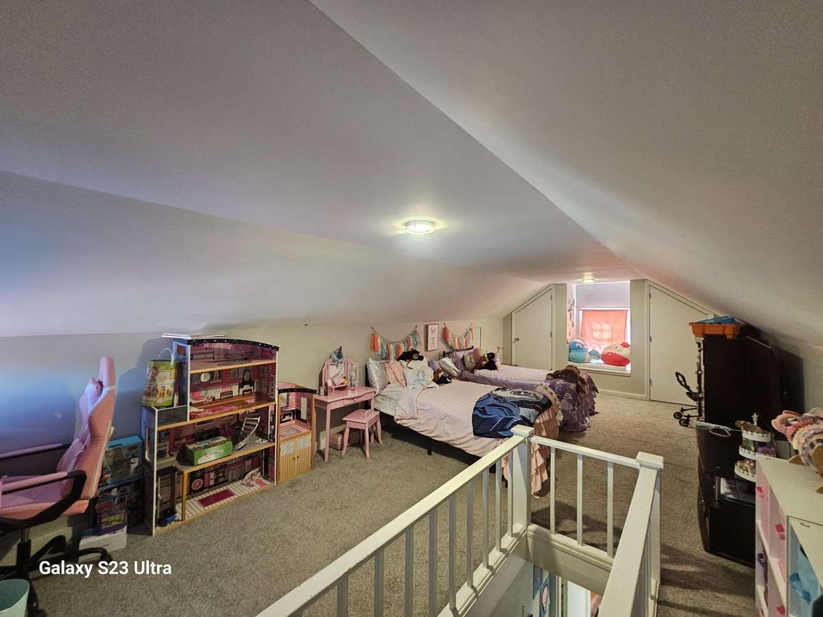 Stairwell leads to an additional bedroom—great for privacy or a separate guest space