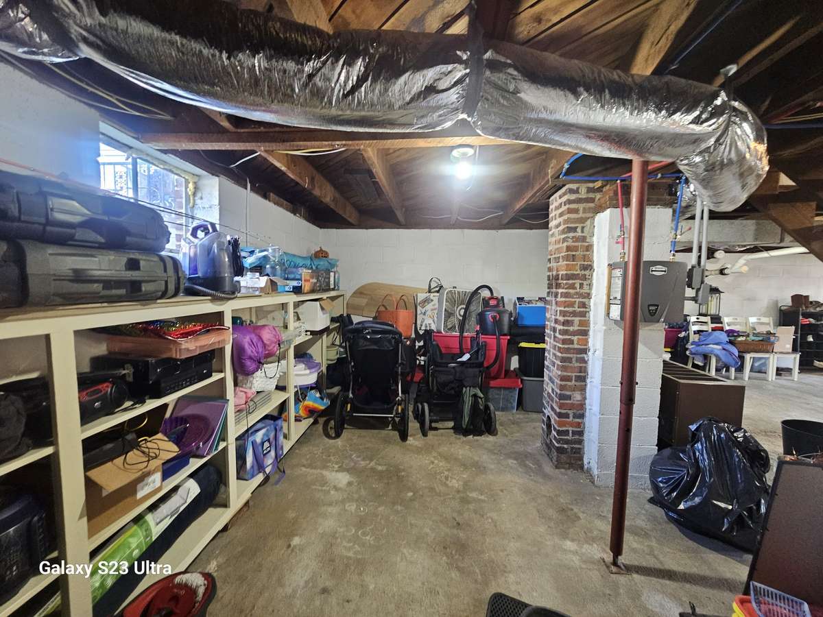 Climate-controlled basement with direct access to the spacious 4-car carport—plus shelving that stays for easy storage and organization