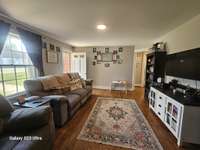 Cozy living room with original hardwood floors