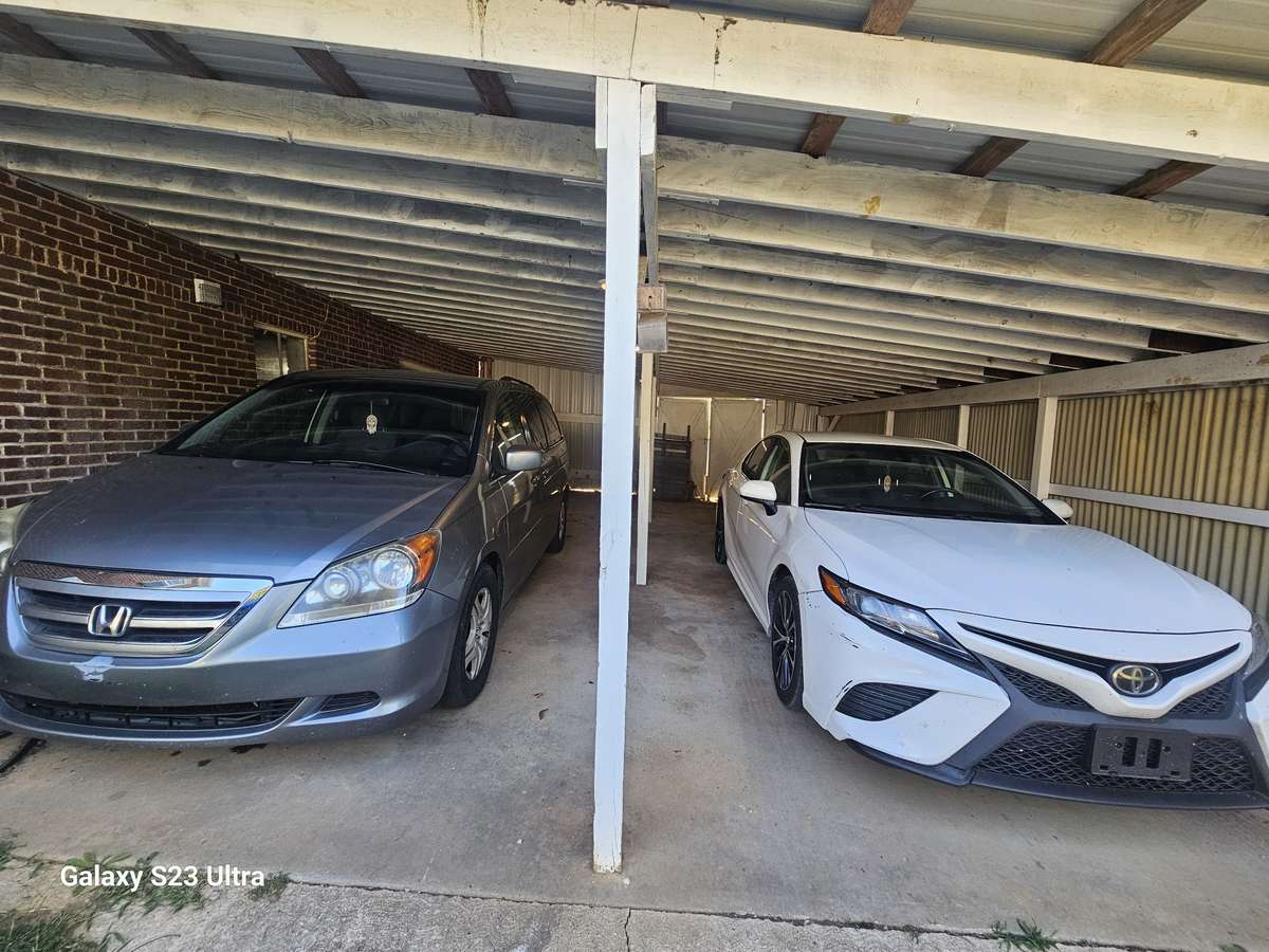 Large carport with room for up to 4 small cars—great for extra parking or covered storage