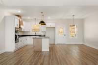 Well Equiped Kitchen with electric smooth cooktop and oven/microwave wall ovens