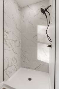 Primary Bathroom with tile shower