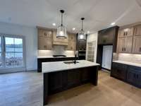 Custom Cabinets with soft close doors, quartz tops.