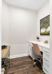 One of the builder upgrades in this unit offers a permanent office space with built-in desk.