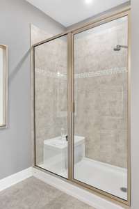 Primary bath with walk-in shower and bench