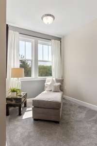 Flexible bonus space in the primary suite is ideal for reading, hobbies, or a secondary office.  The views of the park and greenways are just over your shoulder.