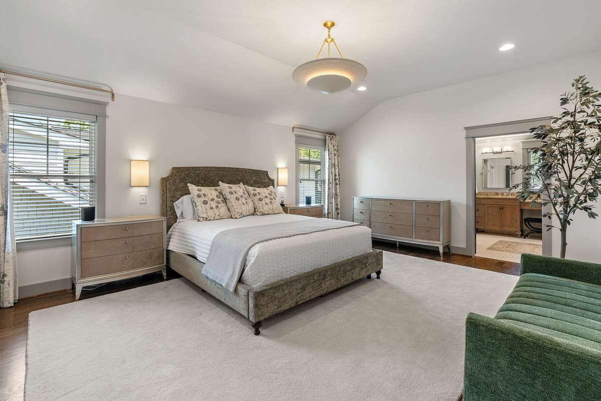 Primary Suite is upstairs in its own wing of the home.