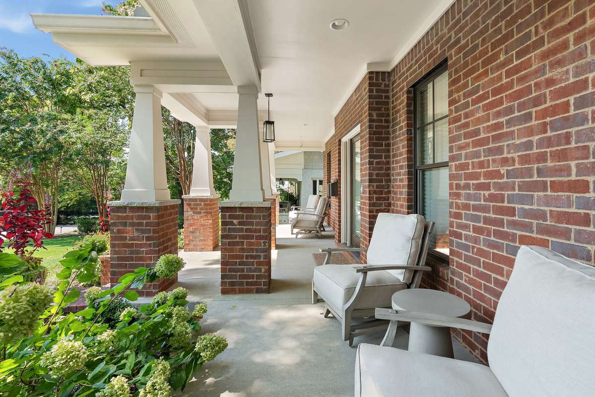 You'll love this classic Foursquare front porch: the perfect place for your coffee or wine with neighbors.