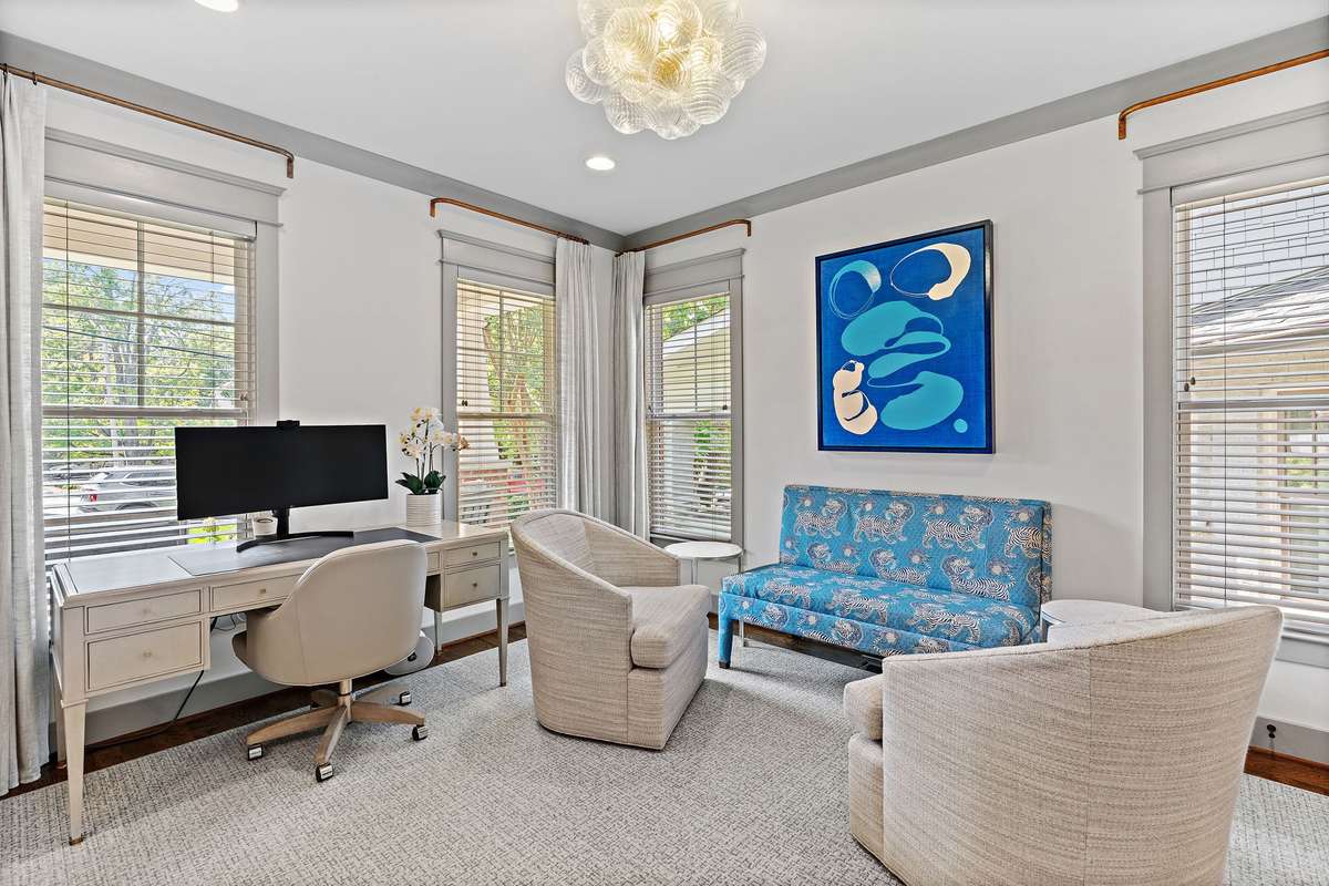 So much natural light in this home. Gorgeous custom window treatments, lighting choices and custom carpets and rugs.