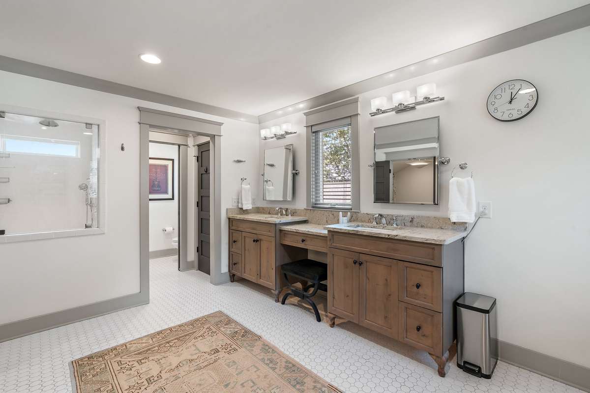 Oversized shower and separate water closet elevate the floor plan.