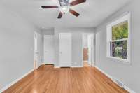 View of the Primary Bedroom with half bath and two closets