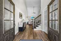 Your guests will be greeted to this beautiful entrance with double doors, high ceilings and lots of charm!