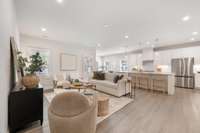 Enjoy this expansive open-concept spice that seamlessly blends the living room, kitchen and breakfast room! The plantation shutters provide timeless elegance and privacy, and the luxury vinyl flooring offers the beauty of hardwoods with durability.