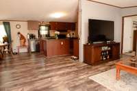 Kitchen is partially open to living room and to large dining area/den