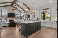 A seamless flow leads into the family room! With backyard views and effortless indoor-outdoor access, this space is perfect for everyday living and stylish entertaining.