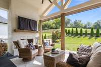 This inviting covered patio is the perfect extension of the home's living space—remote-controlled "blackout" shades for privacy and to keep the hot sun out.
