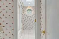 Bathroom two serves bedrooms 2 and 3. A combination shower and tub are separated from the vanity. A skylight brings natural lighting.