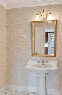 This pedestal sink in the half bath is ready to serve guests.