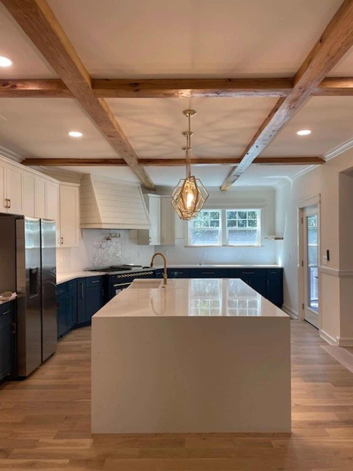 Kitchen opens into the Living Room, Dining Room and Screened Porch.