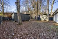 Backyard with 2 storage sheds