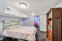 Comfortable guest bedroom ideal for home office, nursery, or additional sleeping space.