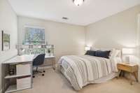 Bedroom three overlooks the backyard and features a walk in closet