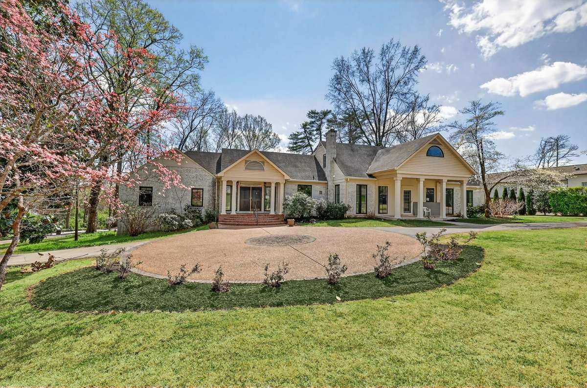 A home designed for entertaining , circular drive parking at front