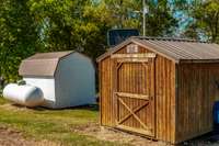 Both storage buildings remain with the property.