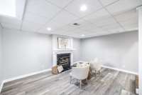 Modern finishes and a walk-out feature ensure this basement space feels like an extension of the home, perfect for casual or work-related area.