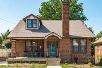 The front yard and walkway showcase the home’s prime location, with sidewalks connecting you to Springfield’s historic downtown square.