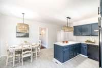 Updated light fixtures add a fresh touch while maintaining the character of this historic home’s kitchen