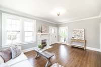 Large windows allow sunshine to pour in, highlighting the perfect blend of historic charm and modern updates.