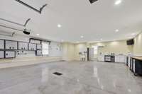 View of finished garage.  Notice all the high end storage cabinets. Lots of clean storage.  Perfect parking and an ideal shop area. Beautifully done.